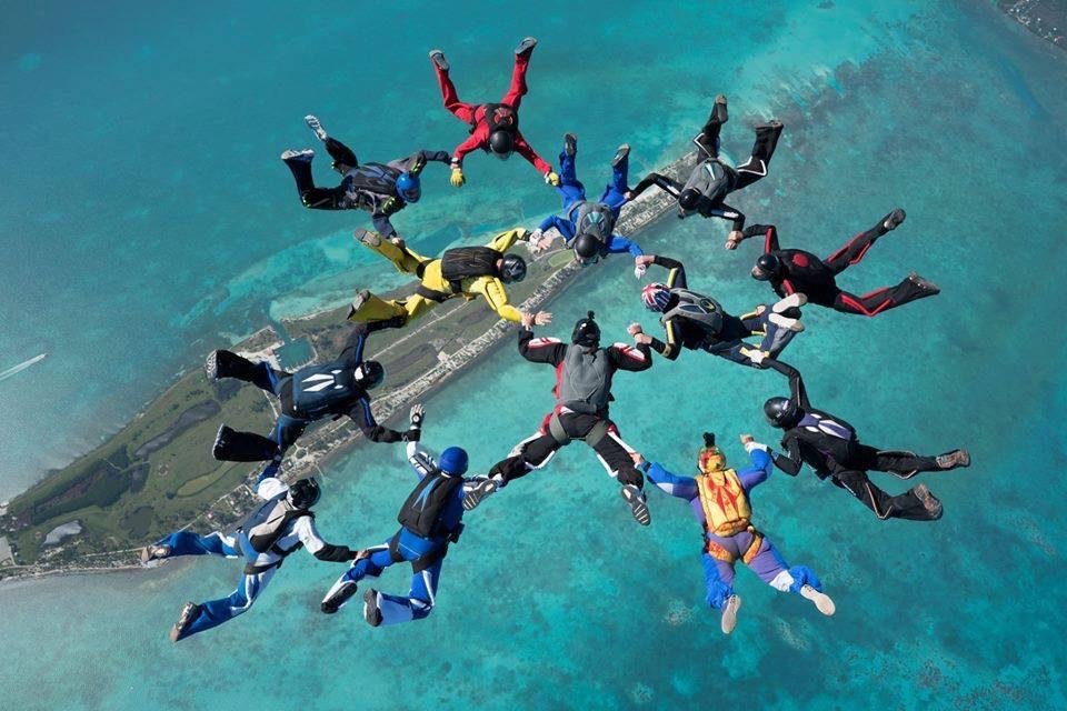 Regan and a group of skydivers jumping above the Maldives. Photo by Tom Sanders Regan and a group of skydivers jumping above the Maldives. Photo by Tom Sanders